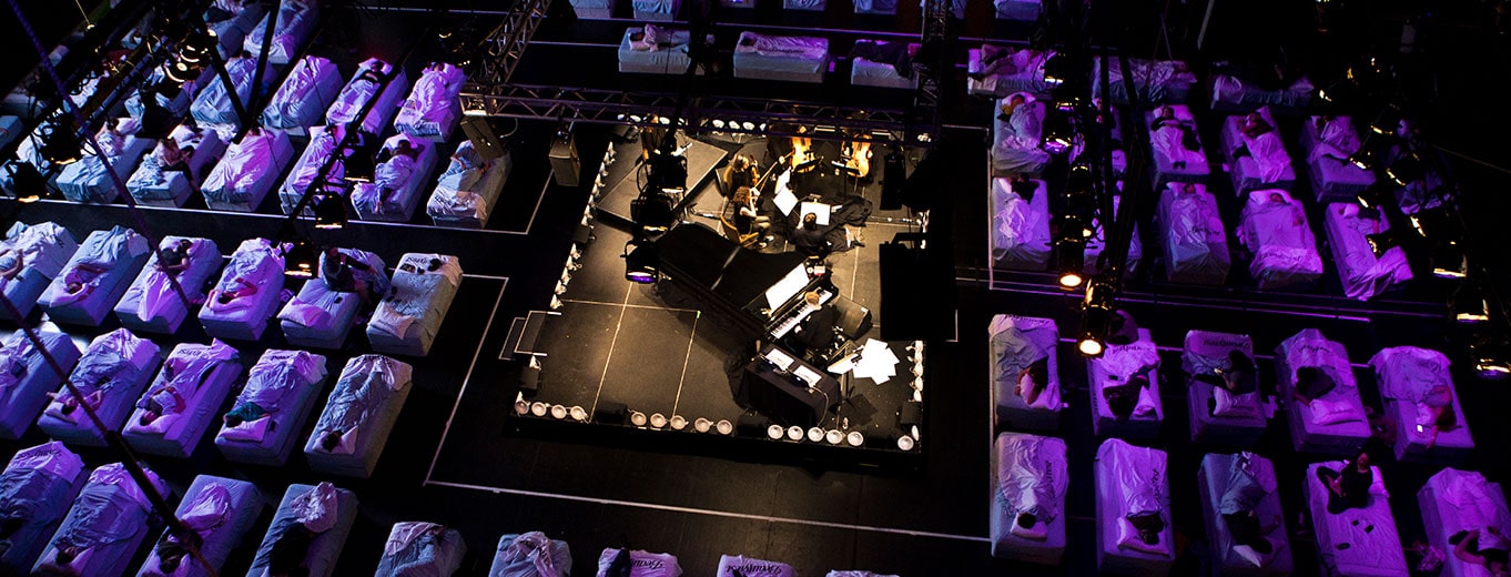 People lying on mattresses as they take in the Sleep concerto, a Beautyrest Be More Awake event developed and executed by the HUNTER integrated marketing and PR firm in NYC.